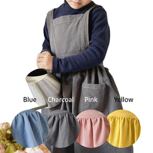 Kids pinafore apron in charcoal, linen and cotton fabric, tie back and roomy pockets in front